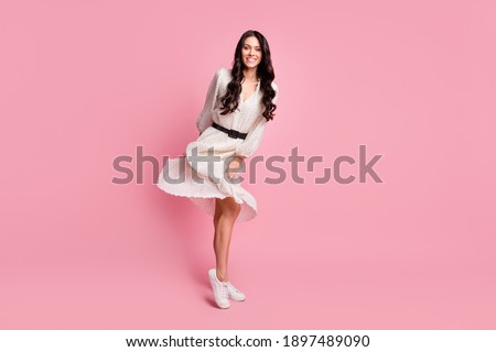 Full length body size photo of female student wearing white stylish dress dancing at party isolated on pastel pink color background
