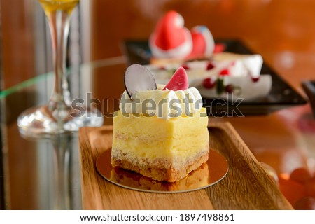 Dessert stand in cafe. Glass stand with different cakes and desserts, sweet food. Eating out concept.
