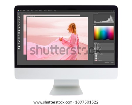 Editing and retouching photo on  desktop computer Royalty-Free Stock Photo #1897501522