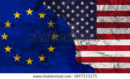 Concept of the Conflict between the United States of America and the European Union with painted flags on a wall with a crack Royalty-Free Stock Photo #1897511275