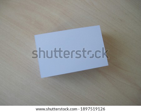 Stack of empty business card on a wooden table