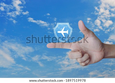 Airplane with shield flat icon over blue sky with white clouds, Business travel insurance and safety concept