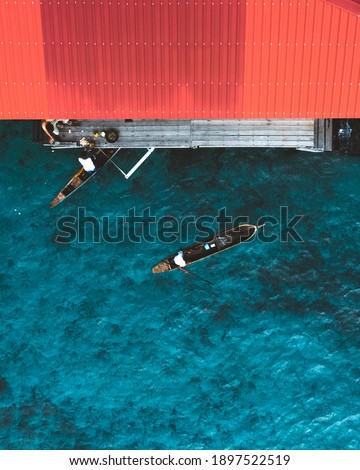 The Bajau Laut people (sea- people) of Mabul Island Sabah Aerial View Selling coconut water to the tourist 