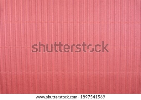 Pink corrugated cardboard close-up. Large texture, isolated background, template for design.