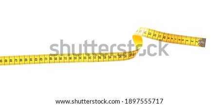 New yellow measuring tape isolated on white, top view Royalty-Free Stock Photo #1897555717