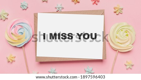 Gifts with note letter on isolated pink background with sweets, love and valentine concept with text I miss you