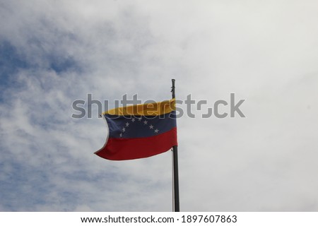 A low angle shot of the flag of Venezuela