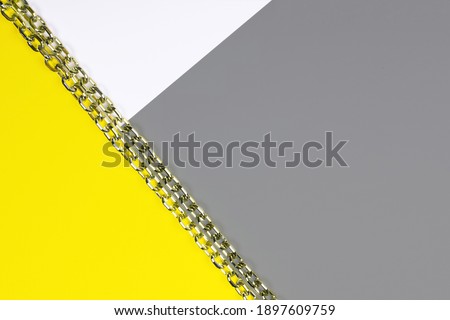 Abstract geometric background. Sheets of colored paper illuminating, yellow, ultimate, grey. Color 2021.