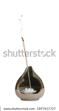 Incense stick smoldering in holder on white background Royalty-Free Stock Photo #1897611727
