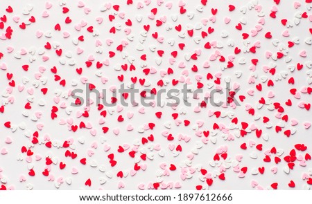 many small colorful hearts background, minimalism concept, love valentine day, woman day, top view, flat lay, copy space