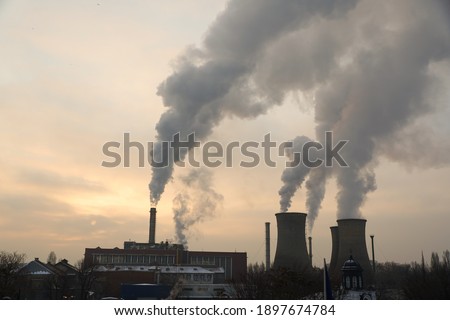 The chimney of a thermal power plant, the smoke extracted by a thermal power plant on the chimney, in the production process. Environment. Pollution.
 Royalty-Free Stock Photo #1897674784