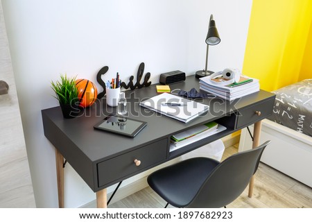 Youth bedroom interior with teenager desk