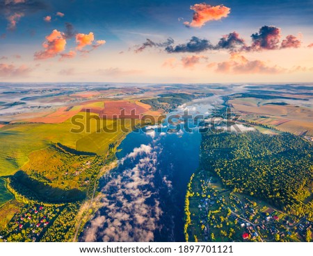 Aerial landscape photography. Splendid summer scene of Ivachiv lake, Ternopil region. Wonderful rural scene from flying drone of Ukrainian countryside. Traveling concept background. 