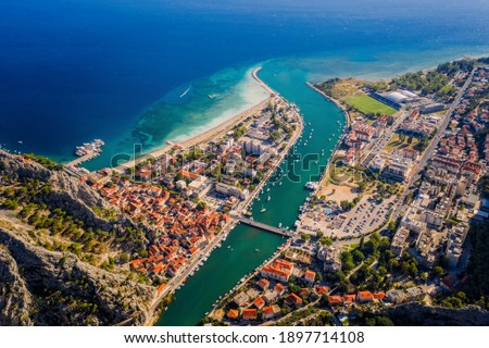 Panorama of town Omis in Croatia - travel background. Aerial drone picture in august 2020 Royalty-Free Stock Photo #1897714108
