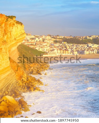 Sunset view of Nazare town - famous tourist destinaton. Portugal