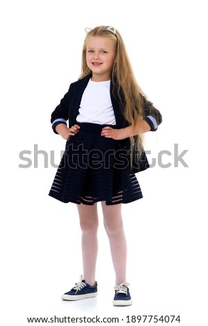 Blonde girl in school uniform. Isolated on white background