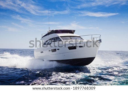 fast motor yacht in navigation, sea view Royalty-Free Stock Photo #1897768309