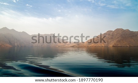 Sea tropical landscape with mountains and fjords, Oman Royalty-Free Stock Photo #1897770190