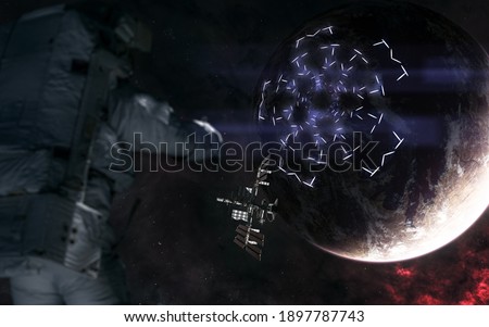 Space station on background of deep space planets. Luminous structures on surface of planet. Astronaut out of focus. Elements of this image furnished by NASA