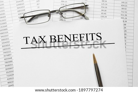 Paper with Tax Benefits on a table