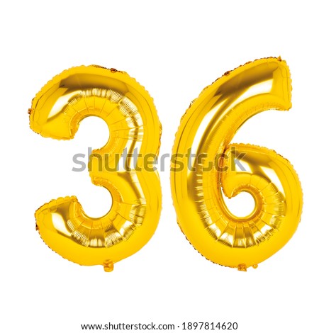 Gold foil balloon figures on white background