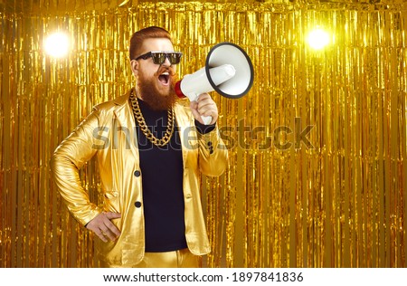 Concept of marketing, sale and discounts. Man in sunglasses, funky jacket and gold chain shouting in loudspeaker. Movie director or music producer with megaphone announces start of casting or audition