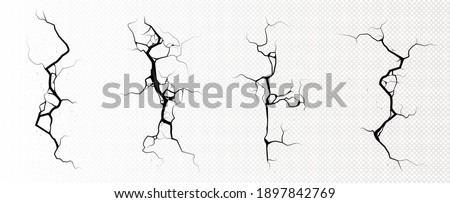 Ground cracks, breaks on land surface from earthquake isolated on transparent background. Vector realistic set of fissure in ground, crevices from disaster or drought, black fractures top view Royalty-Free Stock Photo #1897842769