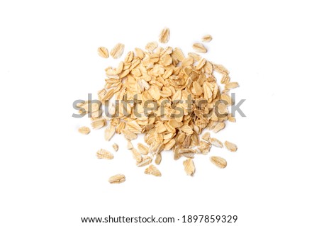 Heap of dry rolled oats isolated  Royalty-Free Stock Photo #1897859329