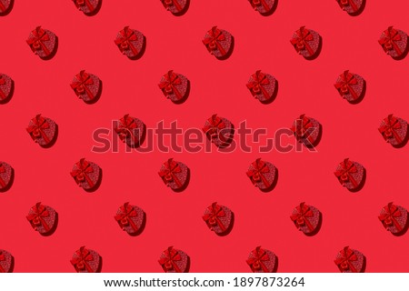 Valentines day seamless pattern of red heart boxes on red background. Greeting card. Good for wallpaper, textile, background, poster, cover of book, post cards.