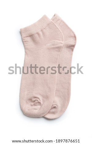 a pair of colored new socks made of fine knitwear isolated on a white background.