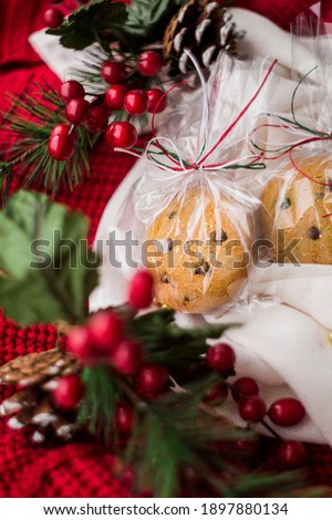 Homemade, fresh, oatmeal cookies on a red and white knitted background or sweater. Christmas decor. perfect for a home table.