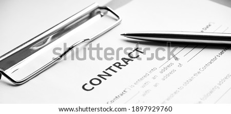 Close-up of a silver pen on docunent contract. Legal contract signing, buy sell real estate contract agreement sign on document paper with black pen Royalty-Free Stock Photo #1897929760