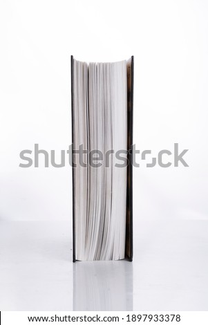 Book on white isolated background, side view Royalty-Free Stock Photo #1897933378