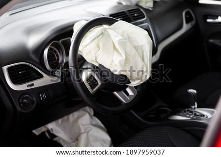 Airbag exploded at a car accident. Car Crash Royalty-Free Stock Photo #1897959037
