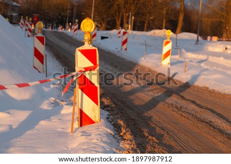 Road works in the city during the winter. Asphalt replaistment