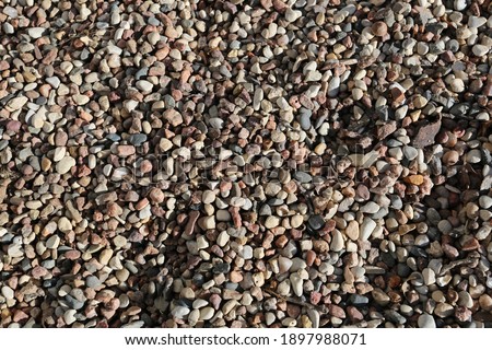 An up close photograph of pea gravel