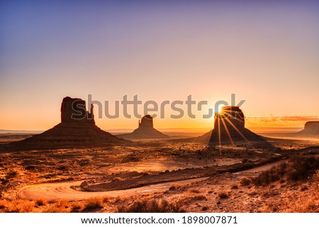 Monument Valley in Navajo National Park at Sunrise, Border of Utah and Arizona, USA  Royalty-Free Stock Photo #1898007871