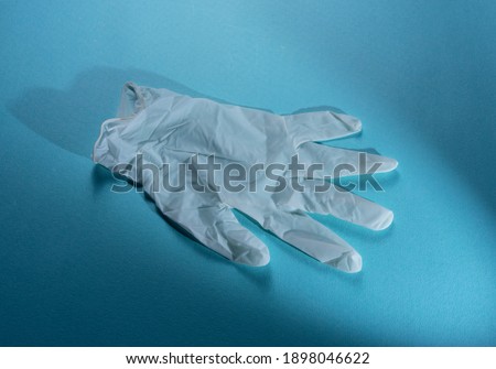 Close up of medical gloves on blue background