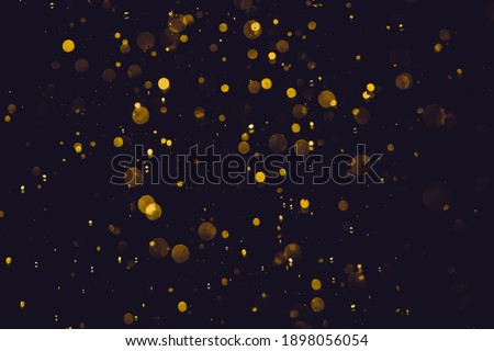 Glittering gold stars of bokeh use for celebrate background