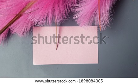 card mockup and pink  reed on grey backgroud