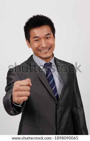 A young business man standing in a shirt high quality photo