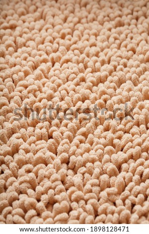 The structure of beige wool fibers in full screen as a background. View from above