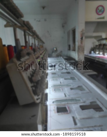 a blurry photo of a computer sewing machine