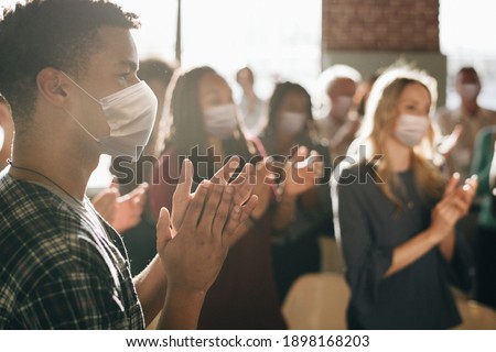 Business party in new normal with crowded people wearing masks Royalty-Free Stock Photo #1898168203