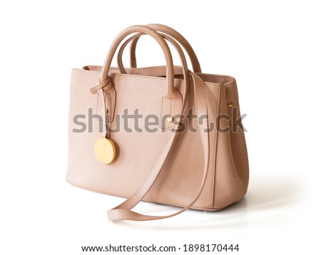 Beige leather women handbag isolated on white background Royalty-Free Stock Photo #1898170444