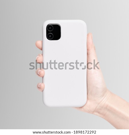 White mobile phone case mockup in hand product showcase Royalty-Free Stock Photo #1898172292