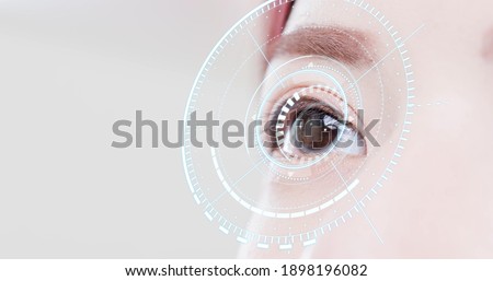 Woman eye with futuristic vision system - Concept of control and security in the accesses technology Royalty-Free Stock Photo #1898196082