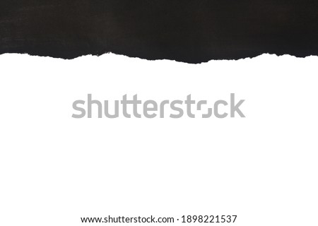 Black torn paper isolated on white background close-up. View from above. Detail for design. Design elements. Macro. Royalty-Free Stock Photo #1898221537
