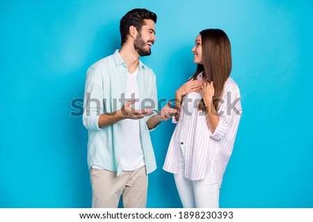 Photo of attractive man and woman married spouses have positive conversation isolated on blue color background Royalty-Free Stock Photo #1898230393