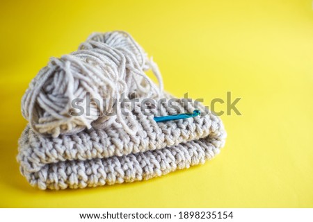 Knitting with crochet in trendly colors. Handmade, DIY concept. Color of a year
